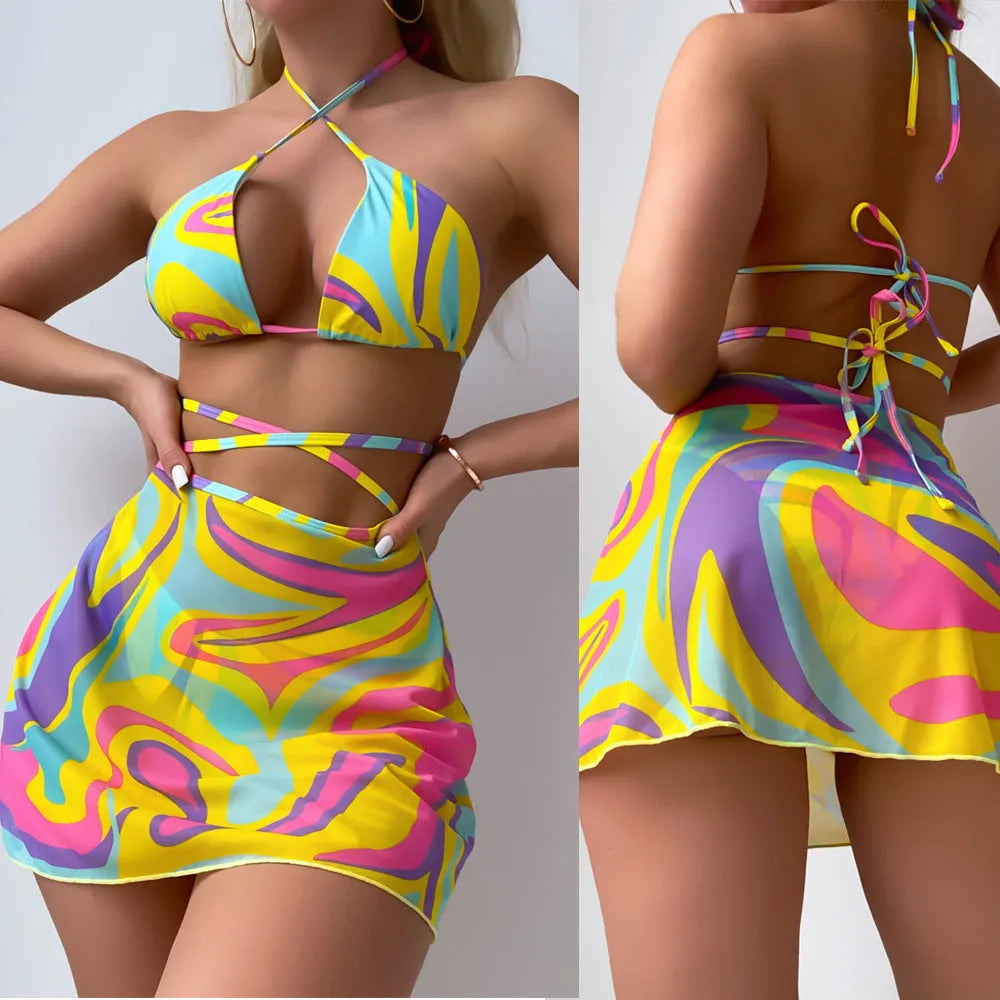 Yellow striped halter-neck swimsuit with lace-up front, matching skirt, and shorts