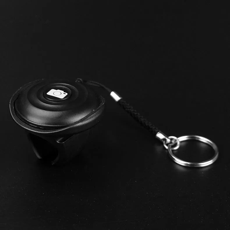 Black Snap Bluetooth remote control for selfies, weighing 27g with over 10-metre range