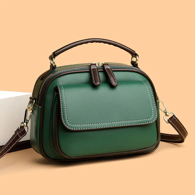 Women's square cross-body shoulder bag in black, green, or orange with double shoulder straps