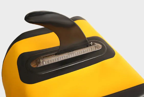 SUP paddle with detachable fish fins showing screw attachment mechanism and plastic construction