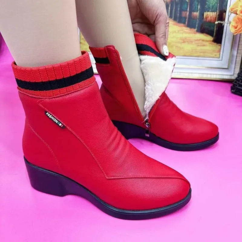 Pair of women's mid heel square heel ankle boots with side zipper and artificial plush lining in black or red