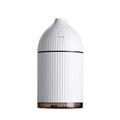 White ultrasonic aromatherapy diffuser with LED light, 300ml capacity, and USB cable on a wooden table