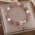 Women's double layer strawberry quartz bracelet with lucky cat charms in red cat's eye flowers colour