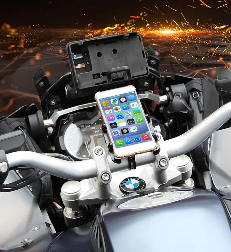 Black aluminium alloy GUB motorcycle phone holder mounted on bicycle handlebars, showing phone clamp.