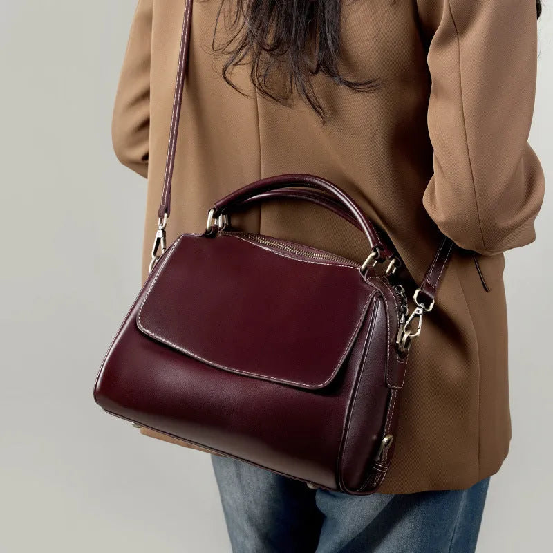 Women's soft genuine leather crossbody tote bag in apricot colour with slit pocket and double straps