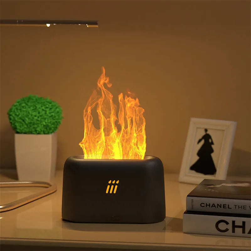 Black flame aroma diffuser humidifier with LED lights creating flame effect on wooden table