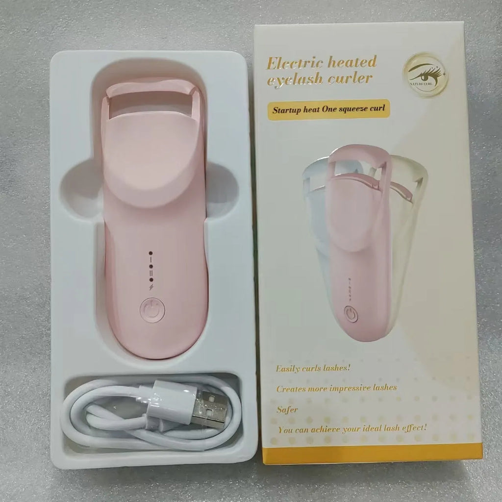 Electric heating eyelash curler in cream white with ceramic plates and USB cable for cordless use