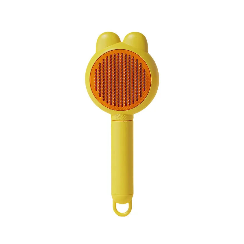 Cat grooming brush with green handle, self-cleaning button, and stainless steel comb for pet hair removal