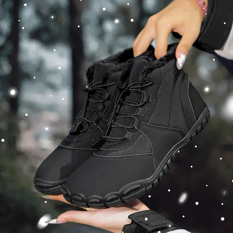 Outdoor snow boots in black with waterproof umbrella cloth, fleece lining, and non-slip rubber soles on a snowy background