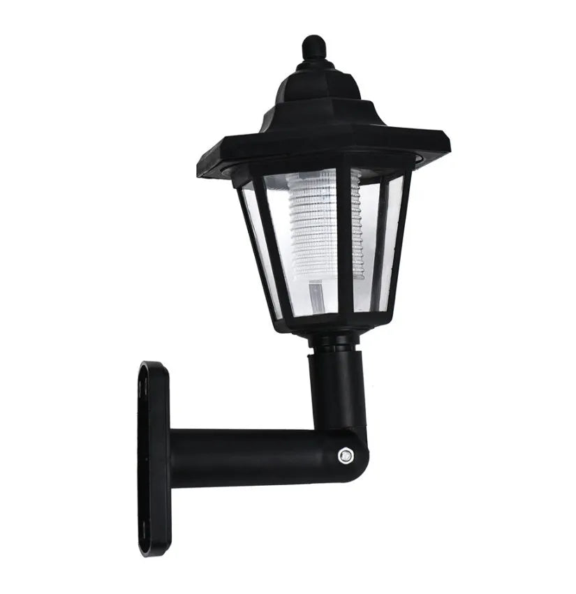 Black hexagonal solar-powered LED wall light for outdoor garden use.