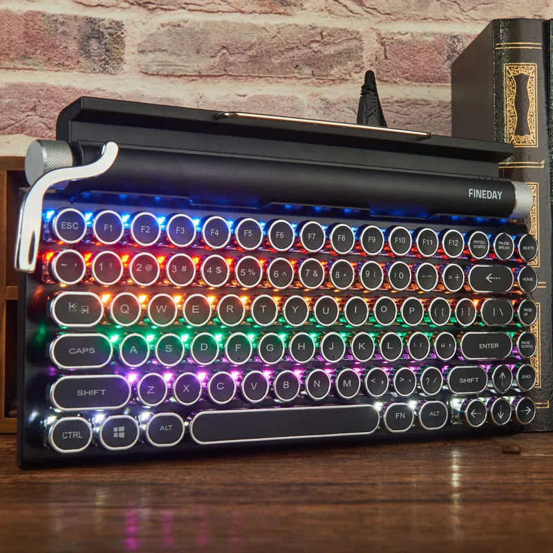 Black Dot retro typewriter mechanical keyboard with 83 keys, seven-colour backlight, and Bluetooth connectivity on a desk