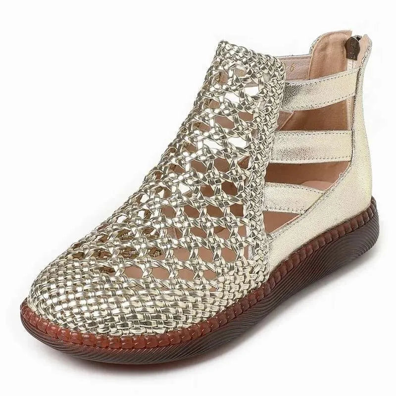 Women's flat sandals with hollow-out design in gold colour showing soft TPR soles and oversleeve style