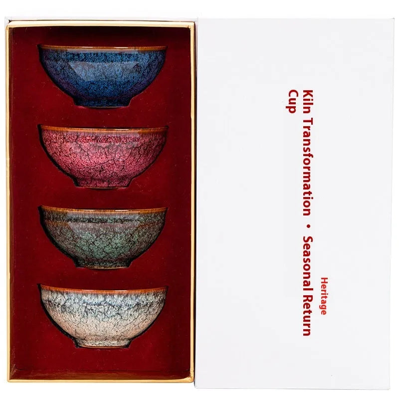 Four ceramic Gongfu tea cups in a light-coloured gift box, new Chinese style.