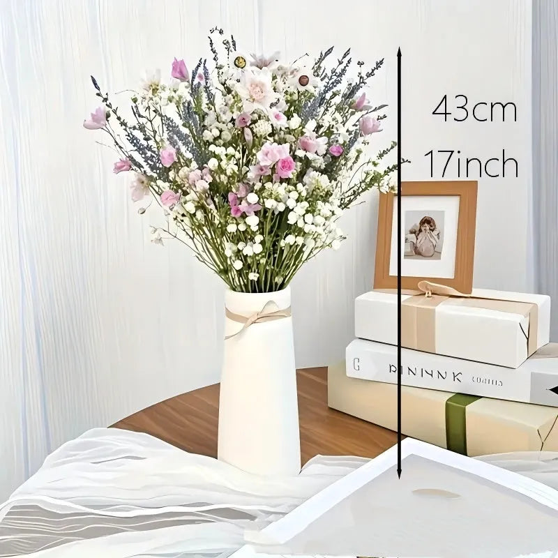 A long dried lavender flower bouquet in a vase, showing white or pink colour options.