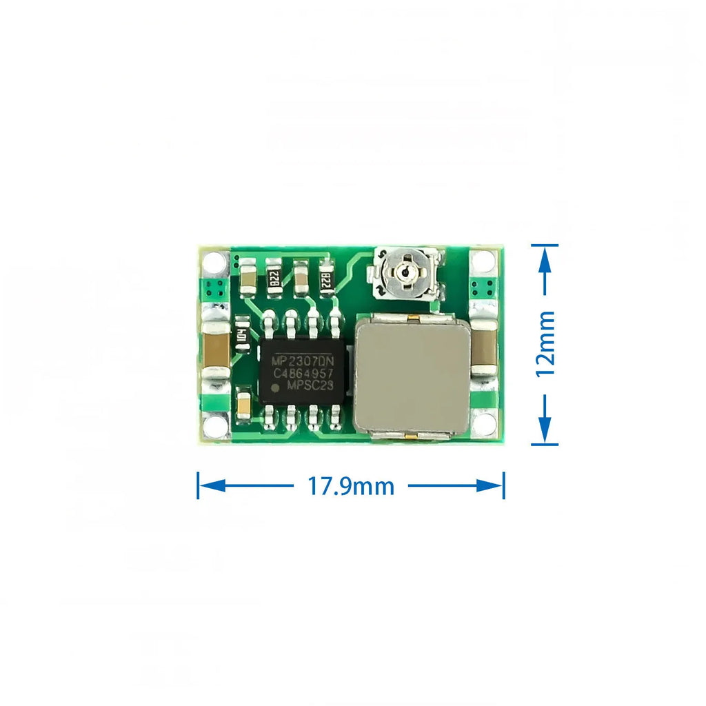 Mini 360 green DC-DC buck converter step down power module on a white background