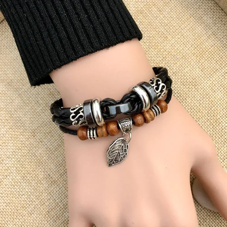 Braided leather bracelet with alloy cross studs, shown in black and brown colour options.