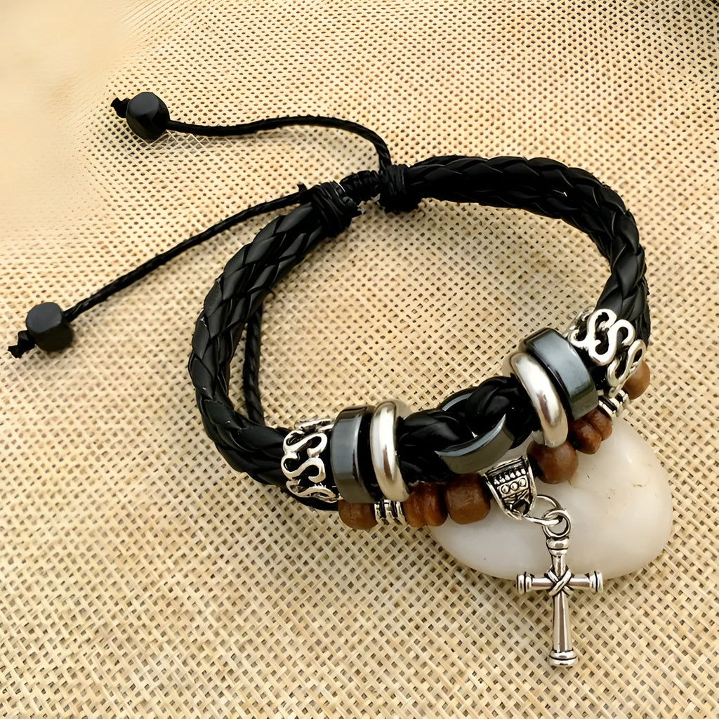 Braided leather bracelet with alloy cross studs, shown in black and brown colour options.