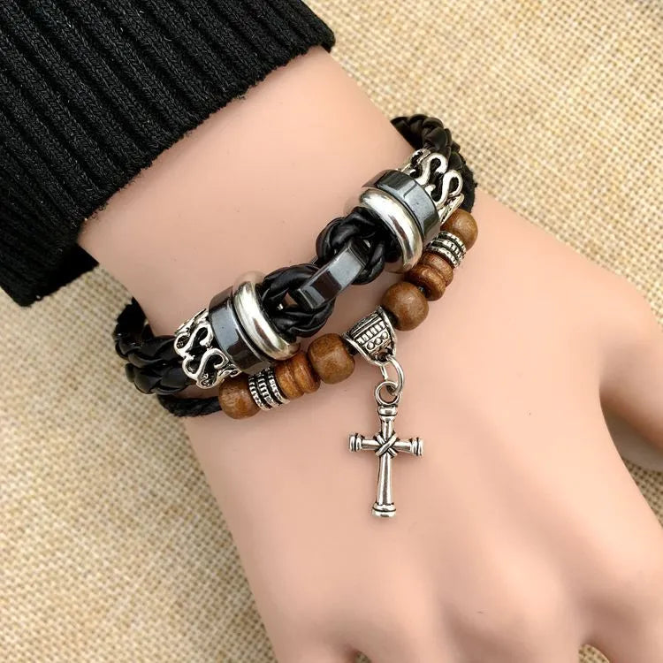 Braided leather bracelet with alloy cross studs, shown in black and brown colour options.