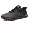 Men's black breathable mesh running shoes with round toe and front lace-up closure on outdoor surface