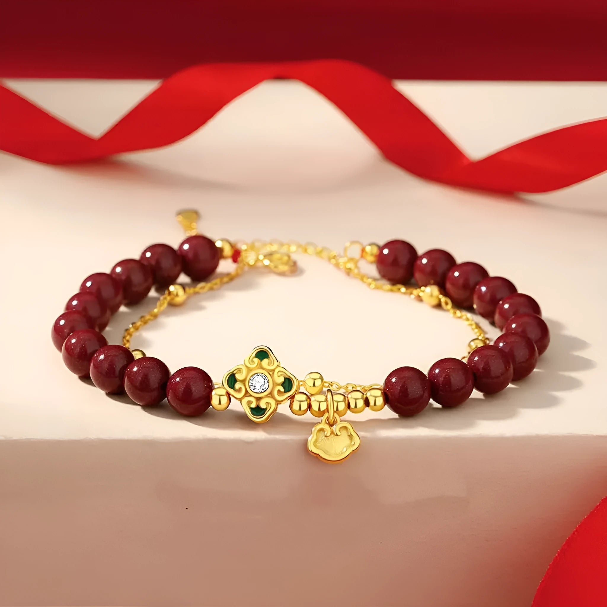 Women's geometric sterling silver bracelet with Ruyi, Xiangyun and red cinnabar flower detailing.