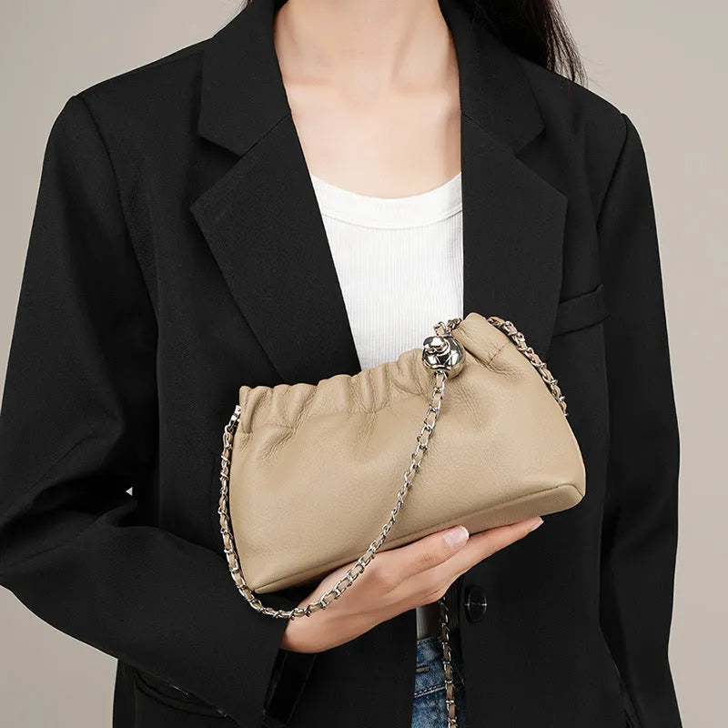 Women's genuine leather crossbody bag with chain strap in Black, Milky White, and Elephant Grey colours.