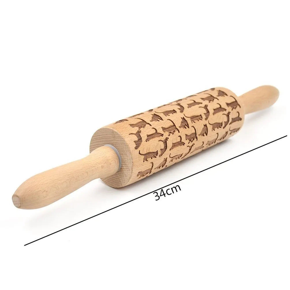 Solid wood rolling pin with embossed Christmas reindeer pattern on a 45cm long shaft.