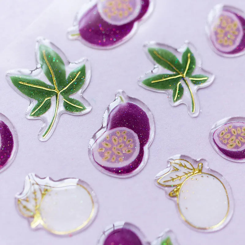 Pack of six DIY fruit bronzing stickers showing grape, orange, passion fruit, peach, pineapple and strawberry designs.