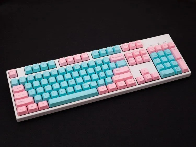 Pink opaque PBT keycap set for mechanical keyboards showing side-engraved legends and 1.5mm thickness