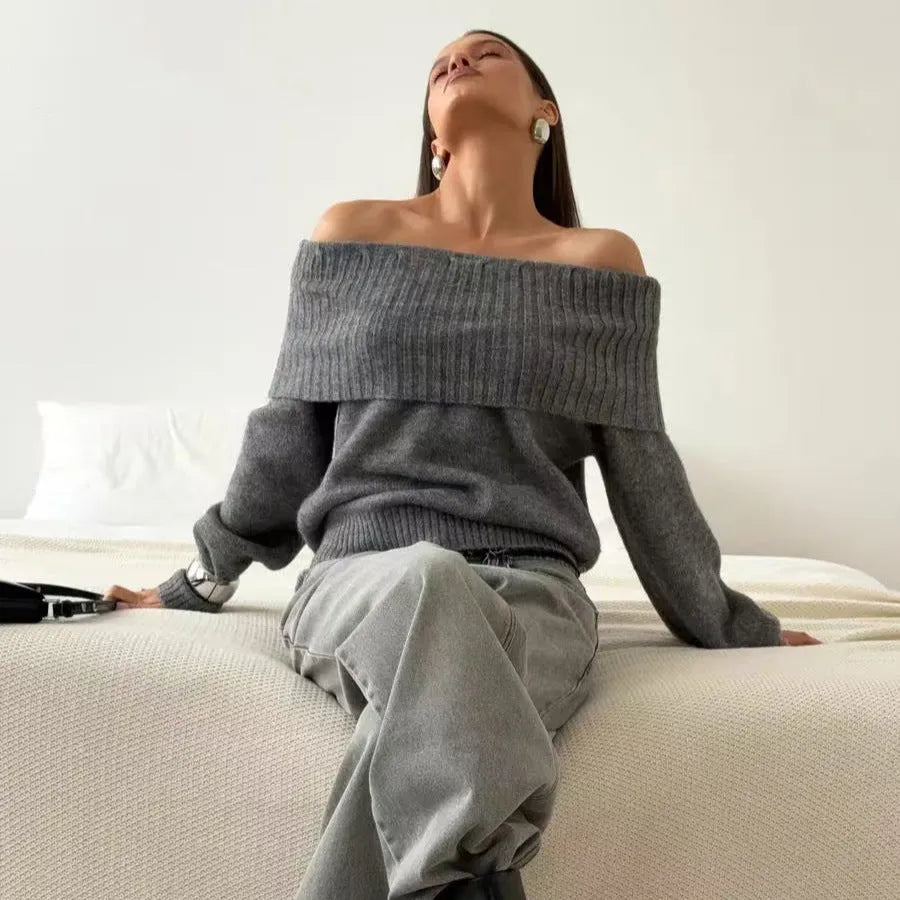 Off-the-shoulder grey sweater with 3D pattern and strapless design, showing regular sleeves and pullover style