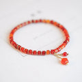Hand-woven red agate bead bracelet with diamond pattern and lucky charm in ethnic style
