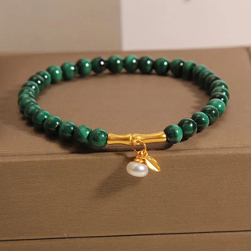 White crystal lucky bamboo bracelet for women with a high-rise design on a wrist.