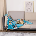 Double-sided dog blanket with cartoon patterns in blue dog, khaki paw, and blue paw designs on polyester flannel