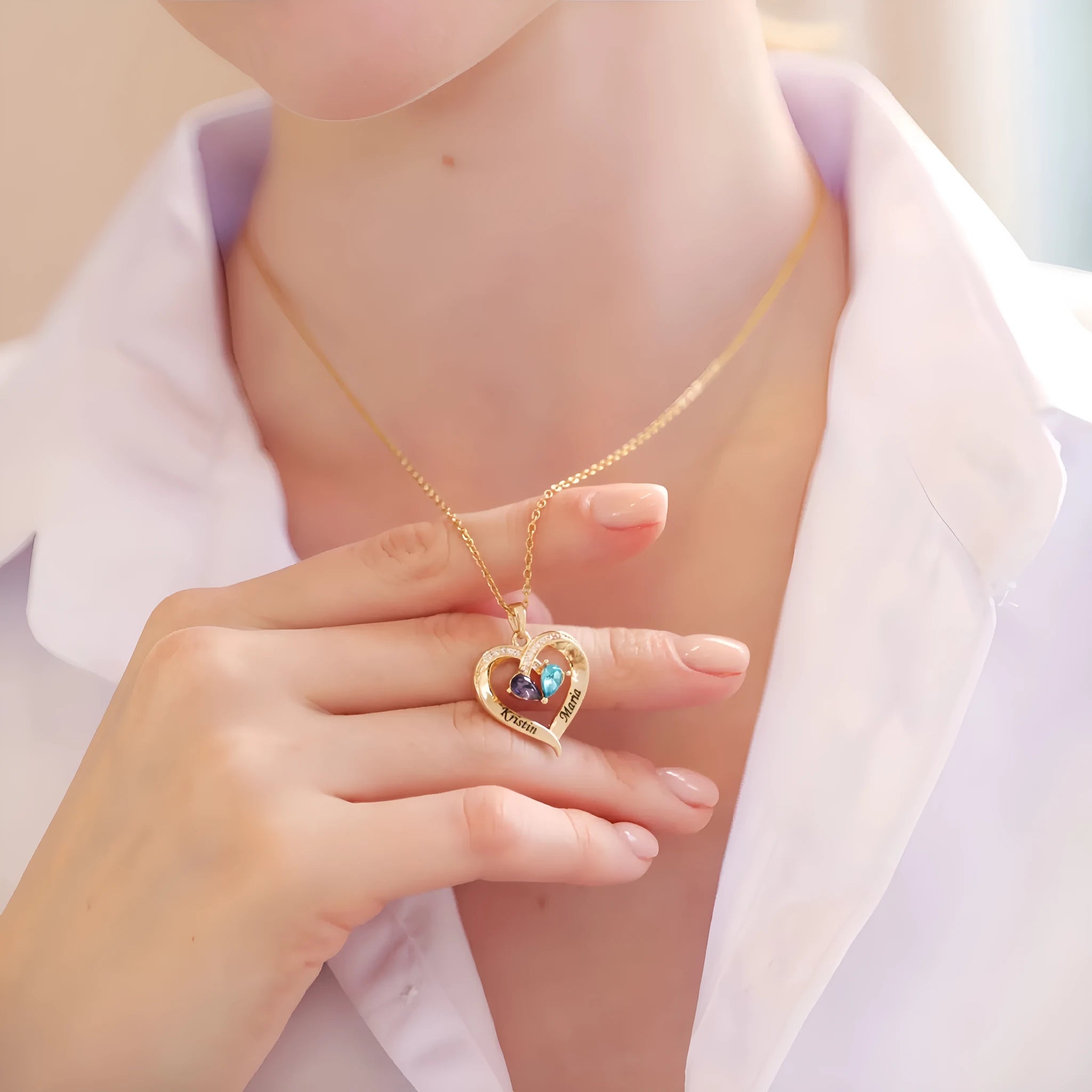 Two-colour water drop heart shape pendant necklace with diamond and birthstone on a gold chain.