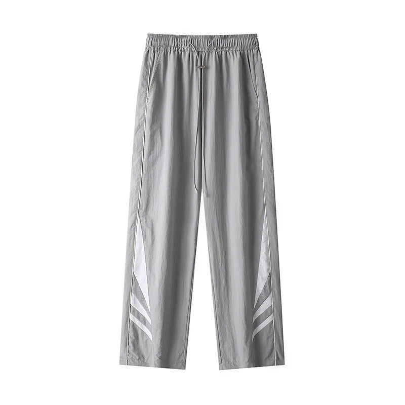 Straight-leg cotton blend trousers in black or grey with button fly and mid-waist design