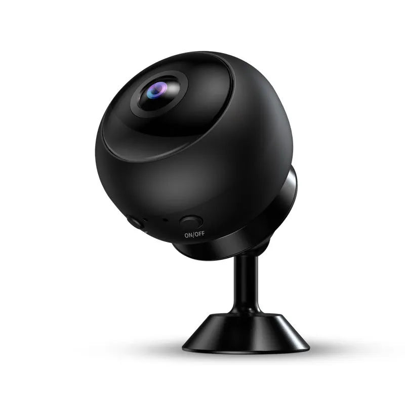 White or black 1080p wireless Wi-Fi surveillance camera with USB cable on a shelf.