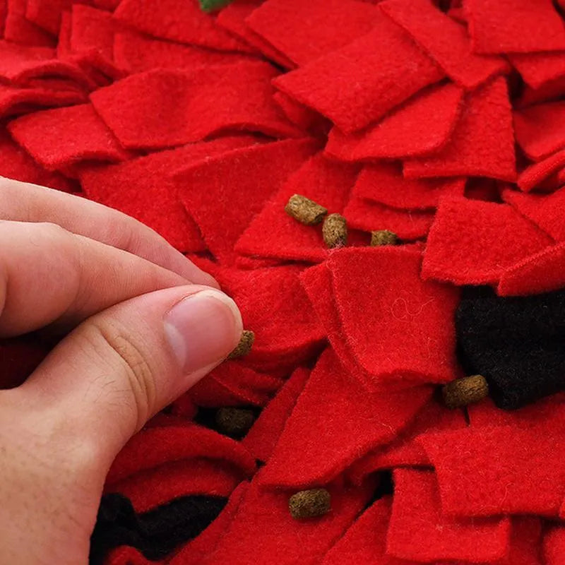 Red and green strawberry-shaped pet slow feeder mat with hiding spots for foraging