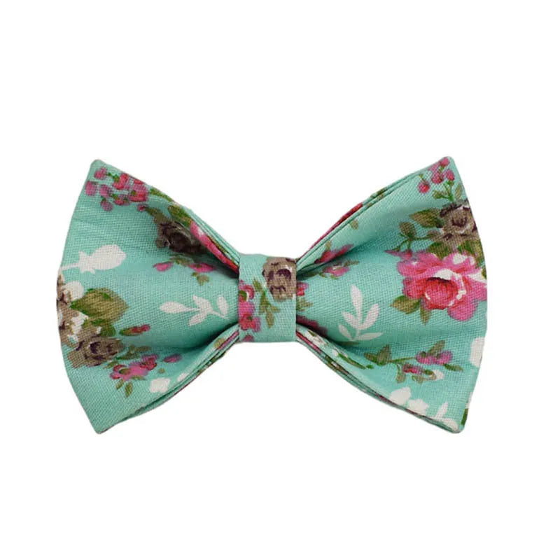 Rose pattern with green background fabric dog collar, leash, detachable bow, and vest set for pets.