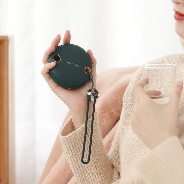 Green hand warmer power bank showing digital display with 5000mAh capacity and Type-C port