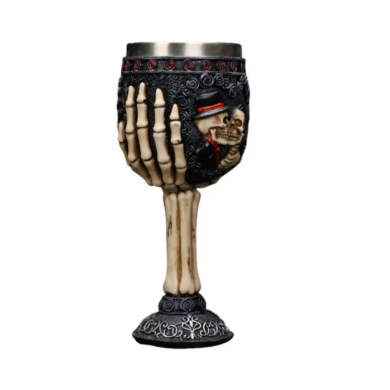 Two stainless steel red wine glasses with a detailed skeleton design, shown as a couple's set.