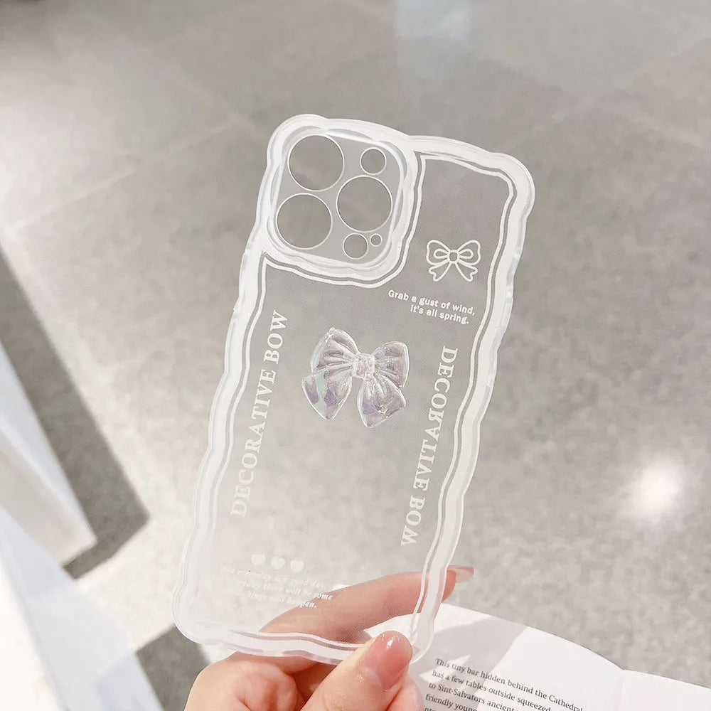 Transparent iPhone case with raised ice-through bow design on clear TPU background showing phone compatibility