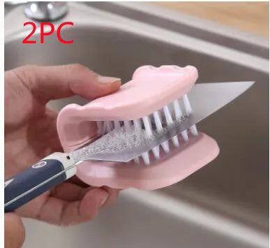 Blue U-shaped plastic brush for cleaning kitchen knives and cutlery on a kitchen counter.