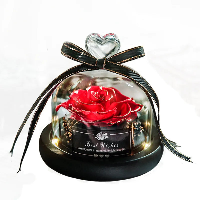 Eternal real rose with LED light inside a 13x13x12cm transparent glass dome, available in multiple colours