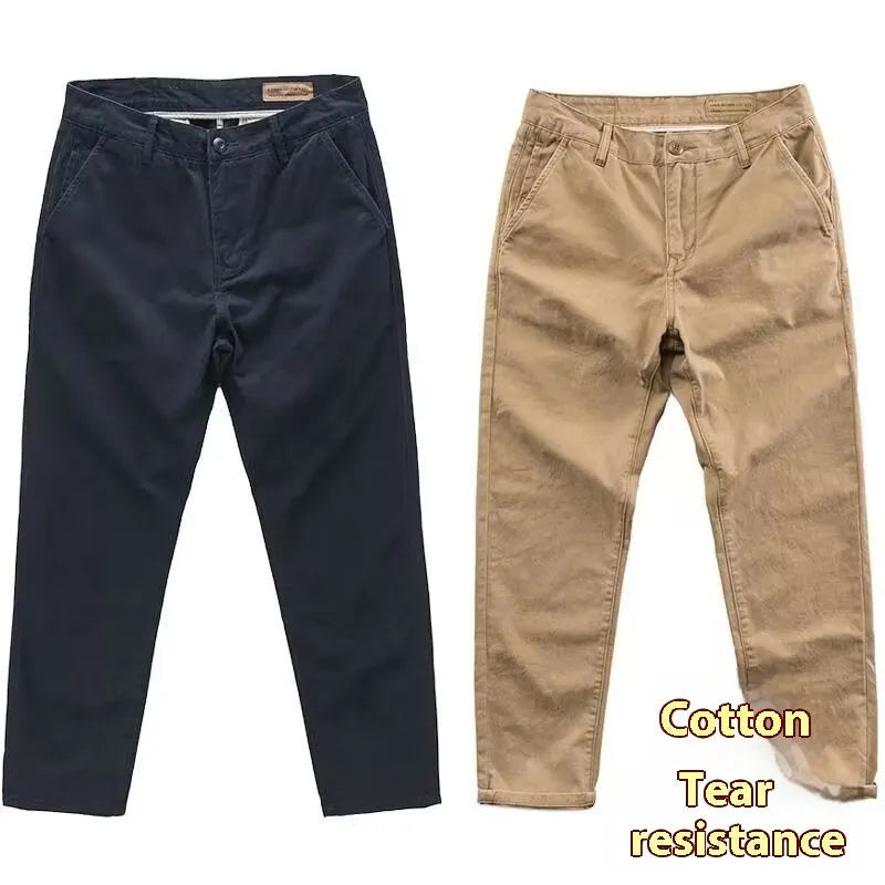 Men's slim-fit casual trousers in a micro elastic fabric, shown in a straight-leg cut and solid colour.