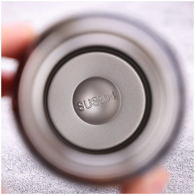 500ml insulated bike water bottle in double stainless steel, 24 x 6.6cm, shown in Black, Green, Pink, or Silver.