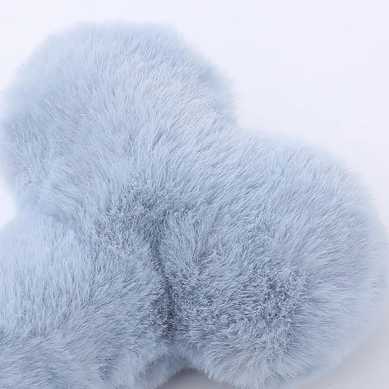 Blue plush bone dog toy with sound feature for interactive play and teeth grinding
