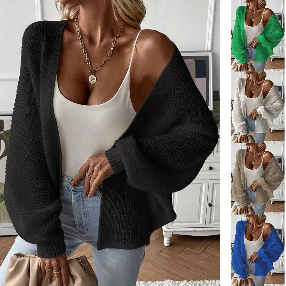 Women's loose fit batwing sleeve cardigan in solid colour, shown on a hanger.