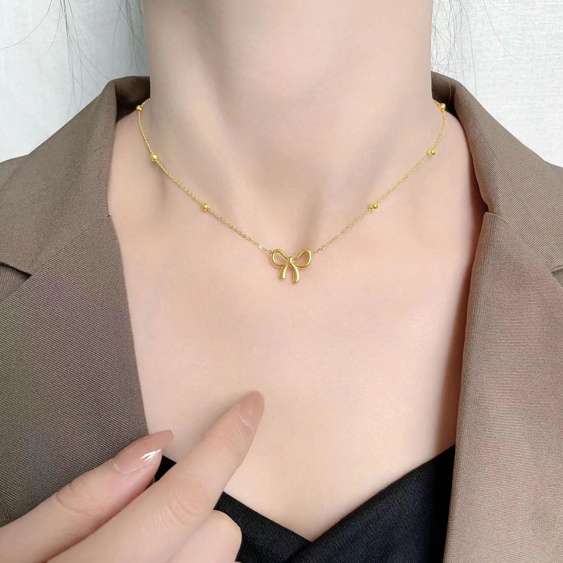 Gold bow necklace with adjustable 41-50cm titanium steel cross chain, European fashion design