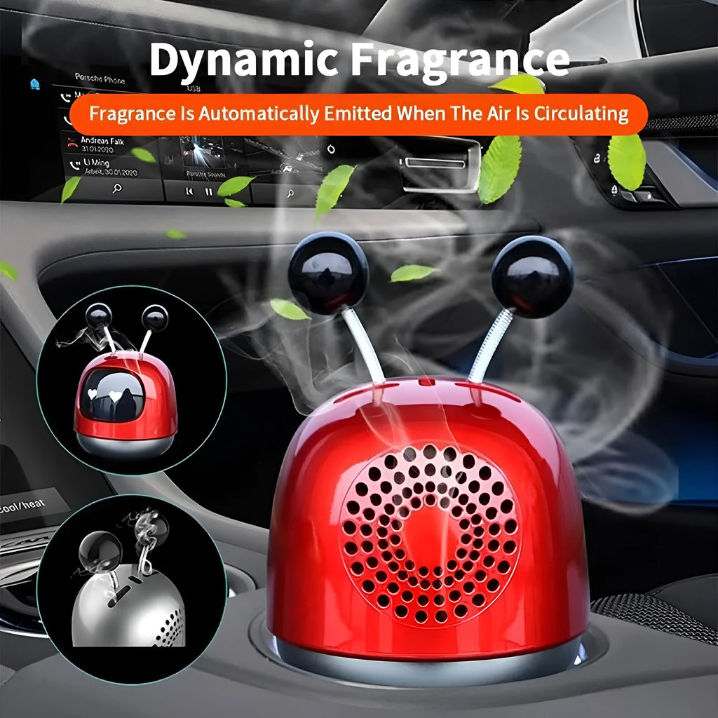 Blue robot car decorative ornament clipped to a car air vent as an aromatherapy diffuser.