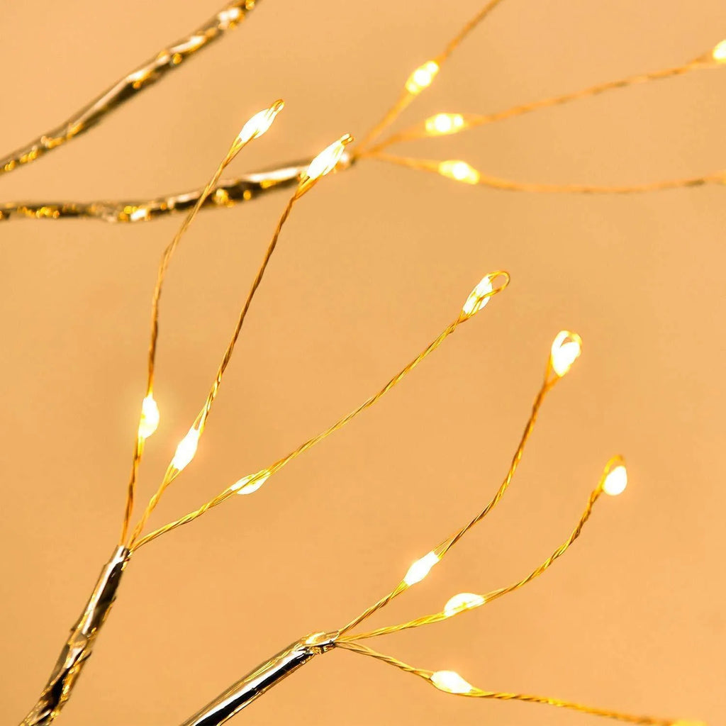 White LED tree-shaped lamp with bendable copper wire branches, 50cm tall, on a table.