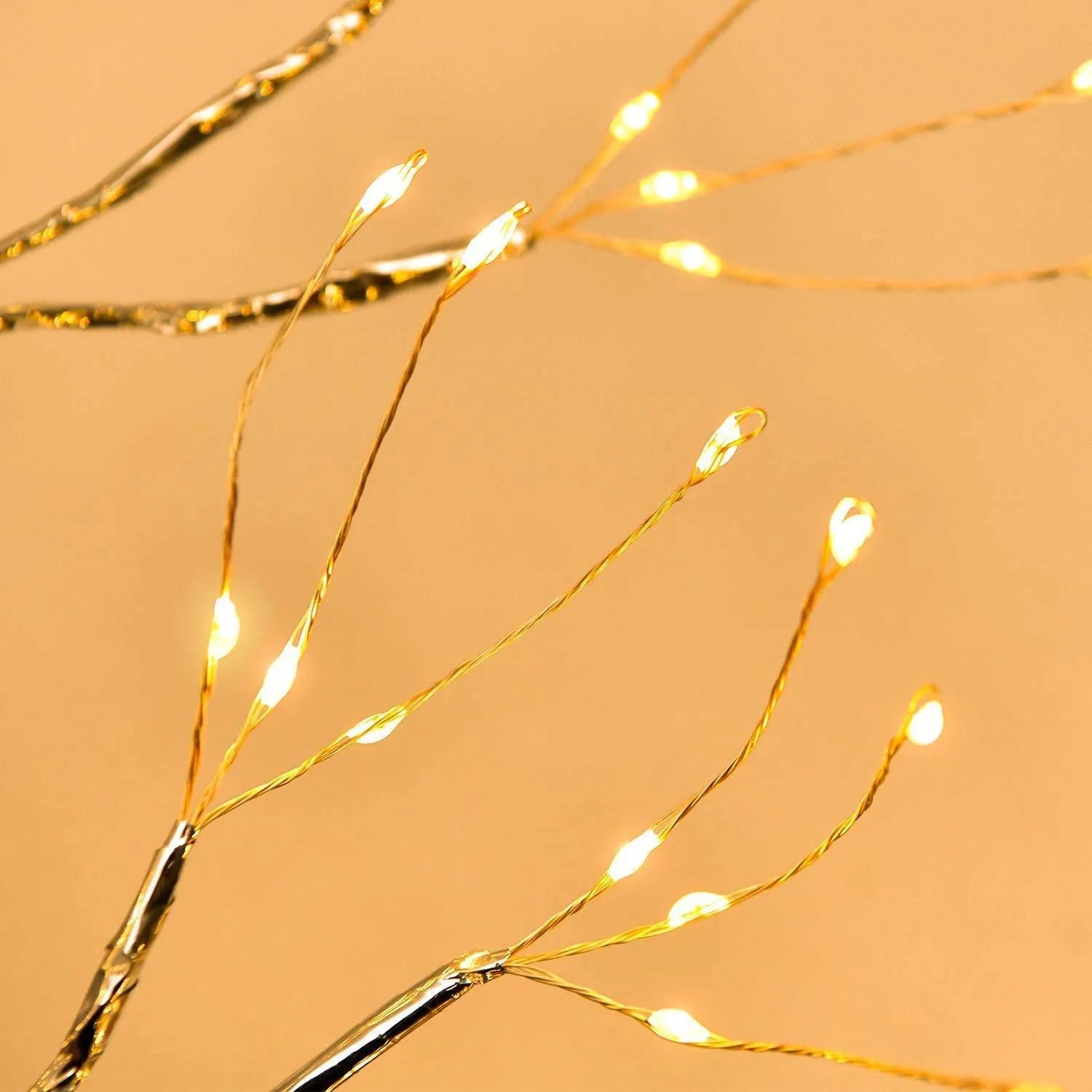 White LED tree-shaped lamp with bendable copper wire branches, 50cm tall, on a table.